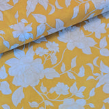 Modern with a vintage feel cotton lawn print with ivory flowers outlined in metallic gold on a sunshine yellow background! Sold at Fabric Focus.