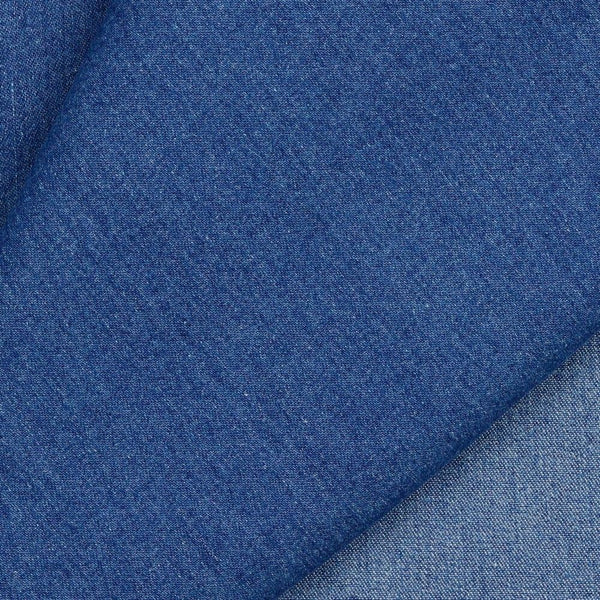 Mid-weight polyester and recycled cotton mix denim with a hint of stretch. Available in 3 indigo shades, this being the mid of the three and ideal for clothing, bag making and lighter furnishing applications. Available to buy in half metre increments.
