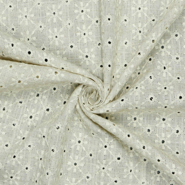 A wonderful medium dressmaking weight linen. Linen mixed with natural viscose in a neutral shade with an all over floral embroidery. Perfect for dresses and jackets. This being the classic natural oatmeal colourway.  Available to buy in metre increments from Fabric Focus Edinburgh. 