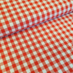 Incredibly versatile, our yarn-dyed* 100% cotton gingham fabric is ideal as a dress fabric and eternally popular for school uniforms, tablecloths, bunting, curtains, aprons, cushions, craft projects, Christmas decorations and much, much more. This being the rich red colourway. Available to buy at Fabric Focus.