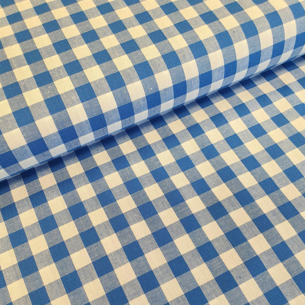 Incredibly versatile, our yarn-dyed* 100% cotton gingham fabric is ideal as a dress fabric and eternally popular for school uniforms, tablecloths, bunting, curtains, aprons, cushions, craft projects, Christmas decorations and much, much more. This being the royal blue colourway. Available to buy at Fabric Focus.