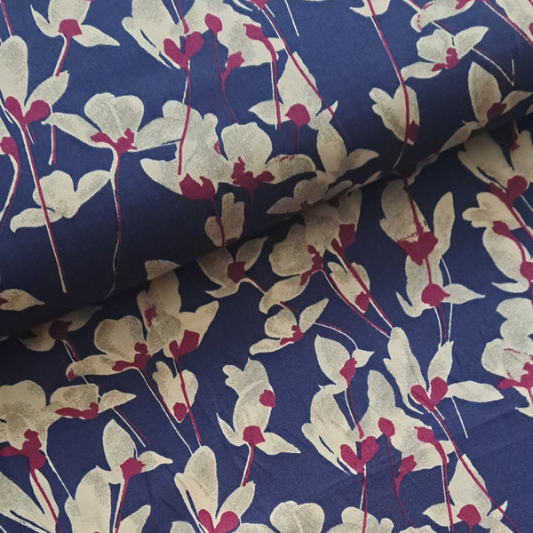 Beautiful trillium cream flowers picked out in hot pink on a deep rich purple background.  Perfect from shirts, tops, dresses and PJs. Available in half metre increments at Fabric Focus. Colours may vary due to differences in computer settings. 