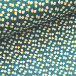 A beautiful ditzy floral of white and yellow on a rich teal background viscose fabric. Perfect for wrap dresses, wide legged trousers and blouses. Great for all summer designs including trousers and dresses. Sold in half metre increments.