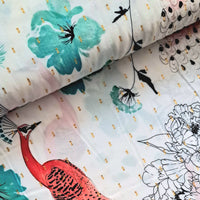 An oriental inspired floral print on a white viscose fabric. Coral pink peacocks amid teal flowers on a soft white background. Picked out with gold metallic accents. Perfect for wrap dresses, wide legged trousers and blouses.