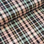Polyester Viscose tartan in pale pink and pale blue with striking black fashion plaid. Sold in half metre increments at Fabric Focus.