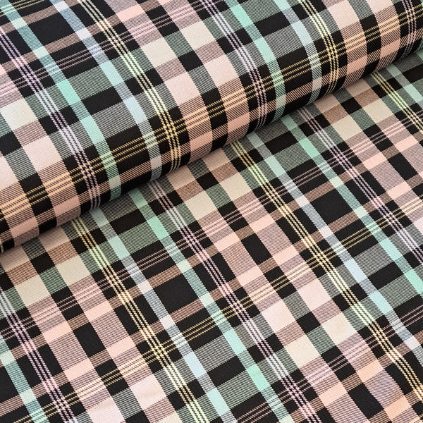 Polyester Viscose tartan in pale pink and pale blue with striking black fashion plaid. Sold in half metre increments at Fabric Focus.