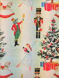 A festive Christmas-themed pattern featuring a nutcracker, a mouse in a red coat, a ballerina in a white dress, a decorated Christmas tree, wrapped gifts, and rocking horses on a pale background.