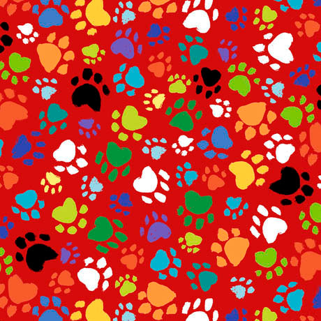  Cat Chat collection of multi coloured paw prints on a red background.  Available to buy in quarter metre increments at Fabric Focus.