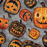 Creepin' It Real - a novelty Halloween print of scary pumpkins on a cotton base. Available to buy in half metre increments at Fabric Focus.