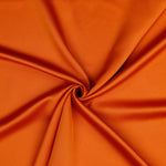 A beautiful soft polyester satin that has a subtle sateen sheen rather than a high gloss finish usually associated with satins. Because of this it has a high-end expensive look. Perfect for evening wear and day wear alike! This being the zingy Flame Orange  colourway.  Sold in half meter lengths at Fabric Focus.