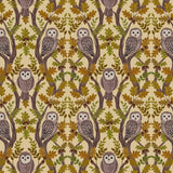 Patterned fabric with owls and leaves on a beige background