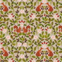 Patterned fabric with foxes, squirrels, oak leaves, and berries on a beige background