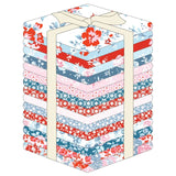 Stack of fabric squares with floral patterns in red, blue, and pink on a white background
