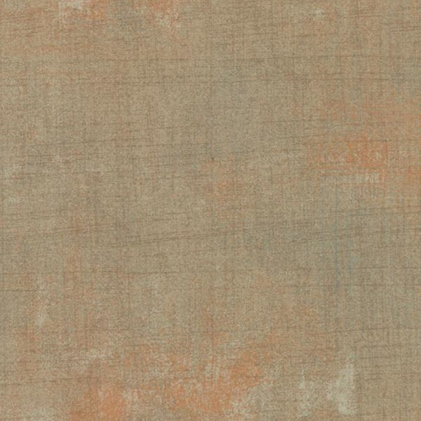 A beige with hints of terracotta grunge print. Grunge Basics from Moda Fabrics is one of our favorite blenders ever! Grunge is great for adding that little extra something to a quilt, like texture and depth.  Available in quarter metre increments at Fabric Focus.