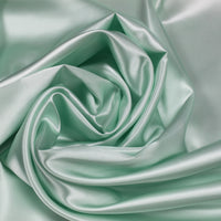A great satin for evening wear or as a luxurious lining to a coat or jacket. Comes in various beautiful shades. This being the cool Mint Green. Dry Clean Only NOTE - This fabric will mark if in contact with water Use a dry iron when pressing Available to buy online in half metre increments at Fabric Focus Edinburgh.