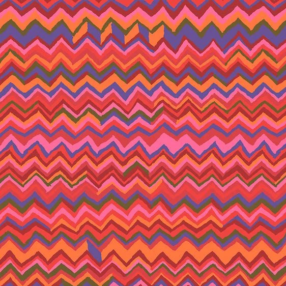 Colorful zigzag pattern fabric of oranges reds and blues