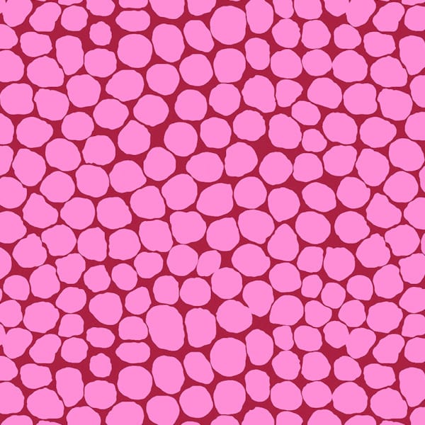 PInk bubble shapes on a darker pink background printed on 100% cotton from Kaffe Fassett. Available in store and online at Fabric Focus