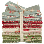 Stack of fabric bundles with a visible brand label on a white background