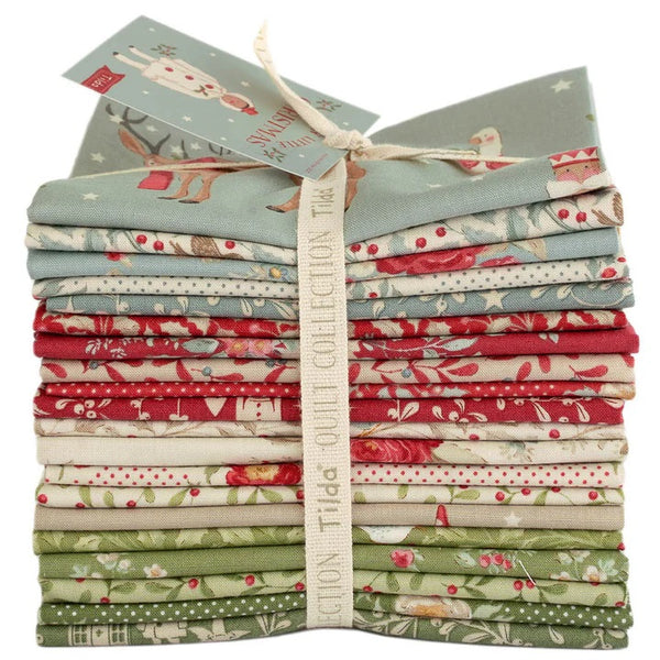 Stack of fabric bundles with a visible brand label on a white background