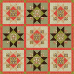 Quilt with geometric pattern featuring red, green, and brown colors on a beige background.