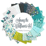 A circular arrangement of patterned fabric swatches in teal, aqua, green, white, and dark navy tones, with a large white center label reading 'Among the Wildflowers 11 by Shelley Cavanna.'.