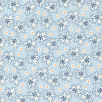 Denim & Daisies white ditzy floral  with orange accent on a blue background from Fig Tree Co for Moda. Sold in quarter metre increments.