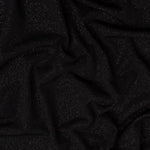 'Dazzle' Jersey is a soft handle, slinky jersey, perfect for dresses skirts and tops. Covered in a fine glitter! Stunning and easy to sew. This being the classic Black colourway. Available to buy in half metre increments.