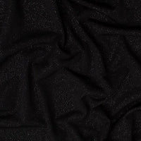 'Dazzle' Jersey is a soft handle, slinky jersey, perfect for dresses skirts and tops. Covered in a fine glitter! Stunning and easy to sew. This being the classic Black colourway. Available to buy in half metre increments.