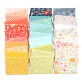 Collection of colorful fabric swatches with various patterns on a white background