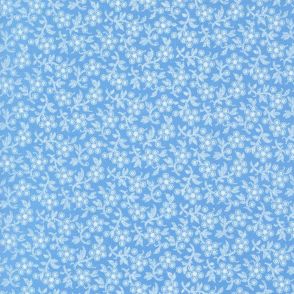 Denim & Daisies white ditzy floral on a blue background from Fig Tree Co for Moda. Sold in quarter metre increments.