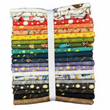 Stack of colorful fabric strips with various patterns tied together on a white background
