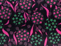 Gorgeous viscose satin print of stars and ribbons in emerald and pink on a midnight background from Fabric Godmother and available at Fabric Focus Edinburgh.