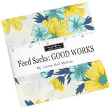 Floral patterned fabric roll with 'Good Works' label on a white background