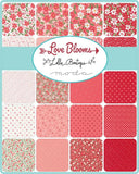 Collection of fabric swatches with floral patterns and 'Love Blooms' branding.