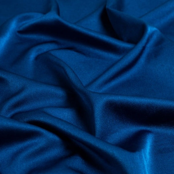 Satin Backed Crepe is a beautiful fabric for draping and is truly reversible. Satin and matt complements each other and both sides can be used in the same garment. Prada, satin back crepe is available in many beautiful colours, this being the rich Petrol teal colourway.  Sold in half meter lengths at Fabric Focus.