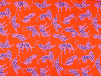 Gorgeous viscose lawn of pink tigers on an orange background from Fabric Godmother and available at Fabric Focus Edinburgh.