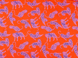 Gorgeous viscose lawn of pink tigers on an orange background from Fabric Godmother and available at Fabric Focus Edinburgh.