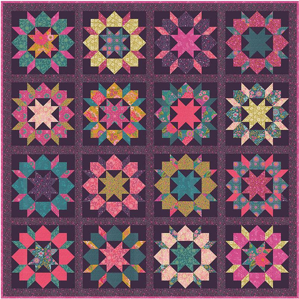 Quilt with colorful star-shaped patterns on a dark background