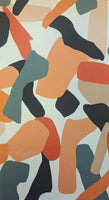 Gorgeous viscose twill of russet, grey beige 'pebble' shapes on a cream background and available at Fabric Focus Edinburgh