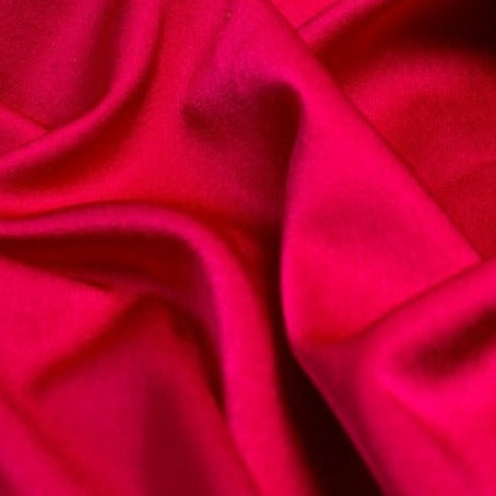 Satin Backed Crepe is a beautiful fabric for draping and is truly reversible. Satin and matt complements each other and both sides can be used in the same garment. Prada, satin back crepe is available in many beautiful colours, this being the vibrant Cerise Pink.  Sold in half meter lengths at Fabric Focus.