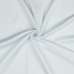 A beautiful soft polyester satin that has a subtle sateen sheen rather than a high gloss finish usually associated with satins. Because of this it has a high-end expensive look. Perfect for evening wear and day wear alike! This being the classic white colourway.  Sold in half meter lengths at Fabric Focus.