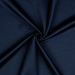 A beautiful soft polyester satin that has a subtle sateen sheen rather than a high gloss finish usually associated with satins. Because of this it has a high-end expensive look. Perfect for evening wear and day wear alike! This being the rich marine blue colourway.  Sold in half meter lengths at Fabric Focus.
