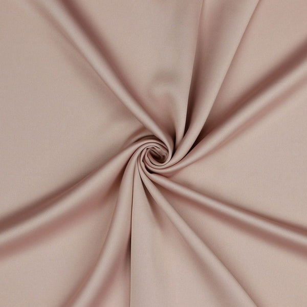 A beautiful soft polyester satin that has a subtle sateen sheen rather than a high gloss finish usually associated with satins. Because of this it has a high-end expensive look. Perfect for evening wear and day wear alike! This being the romantic soft old rose colourway.  Sold in half meter lengths at Fabric Focus.