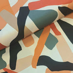Gorgeous viscose twill of russet, grey beige 'pebble' shapes on a cream background and available at Fabric Focus Edinburgh