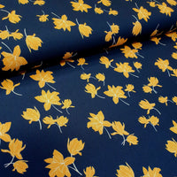 100% polyester crepe print. yellow and navy. Fabric Focus