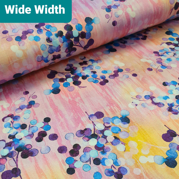 EXTRA WIDE BACKING FABRIC Nature's Pace has an almost painted look to the colour. Blue and Purple berries on a soft pink/lavender background picked out with splashes of yellow.  Great for backing your larger quilts with no seams! Sold in half metre increments at Fabric Focus.