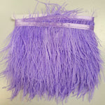 Ostrich feather trim in a lavender colourway on a co-ordinating satin ribbon. Sold in metre increments at Fabric Focus.