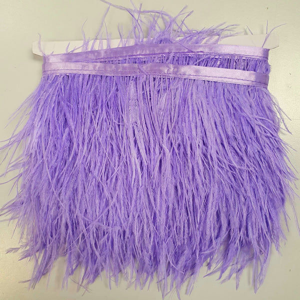 Ostrich feather trim in a lavender colourway on a co-ordinating satin ribbon. Sold in metre increments at Fabric Focus.