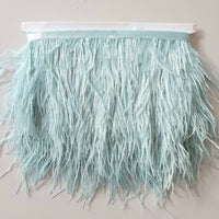 Ostrich feather trim in soft dusky blue colour way. available to buy in store and online at Fabric Focus Edinburgh.