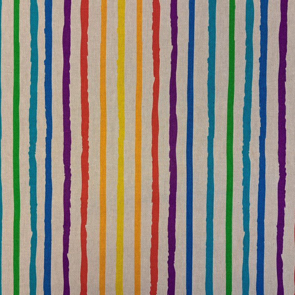 Bright rainbow stripes over a neutral background.   A printed half panama European produced fabric, it is Cotton Rich and is also referred to as a canvas by some. Widely used for Bag Making, Apparel and Crafting. Available in half metre increments at Fabric Focus.
